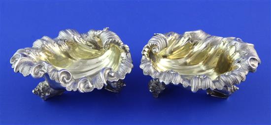 A good pair of Victorian cast silver shell shaped table salts by Edward & John Barnard, 9 oz.